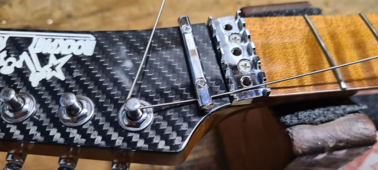 Restring Your Floyd Rose - Kink the String at the Measurement and pull back to Tuning Post