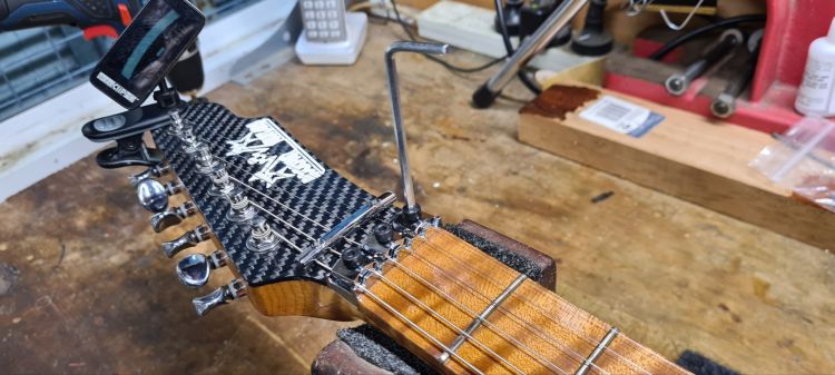 Restring Your Floyd Rose - Tune, Stretch and Tune, then tighten your Lock Nut Clamps