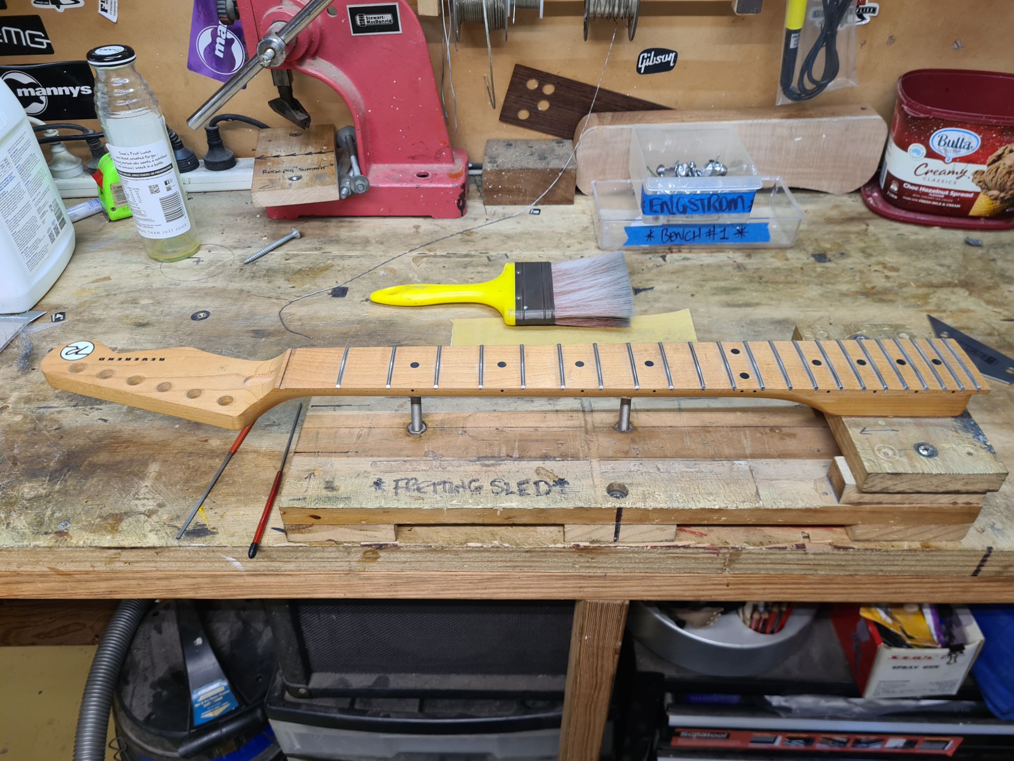 Frets being Levelled in the Jig.